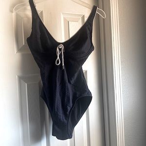 It’s from beach house,a size 10 , the color is dark blue